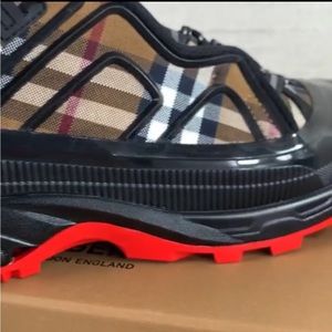 Burberry red bottoms for sale $500 size 11 brown, white, and black stripes.